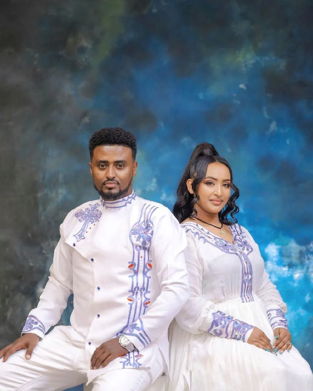 Blue Design Habesha Couples' Outfits in Ethereal Light Hues