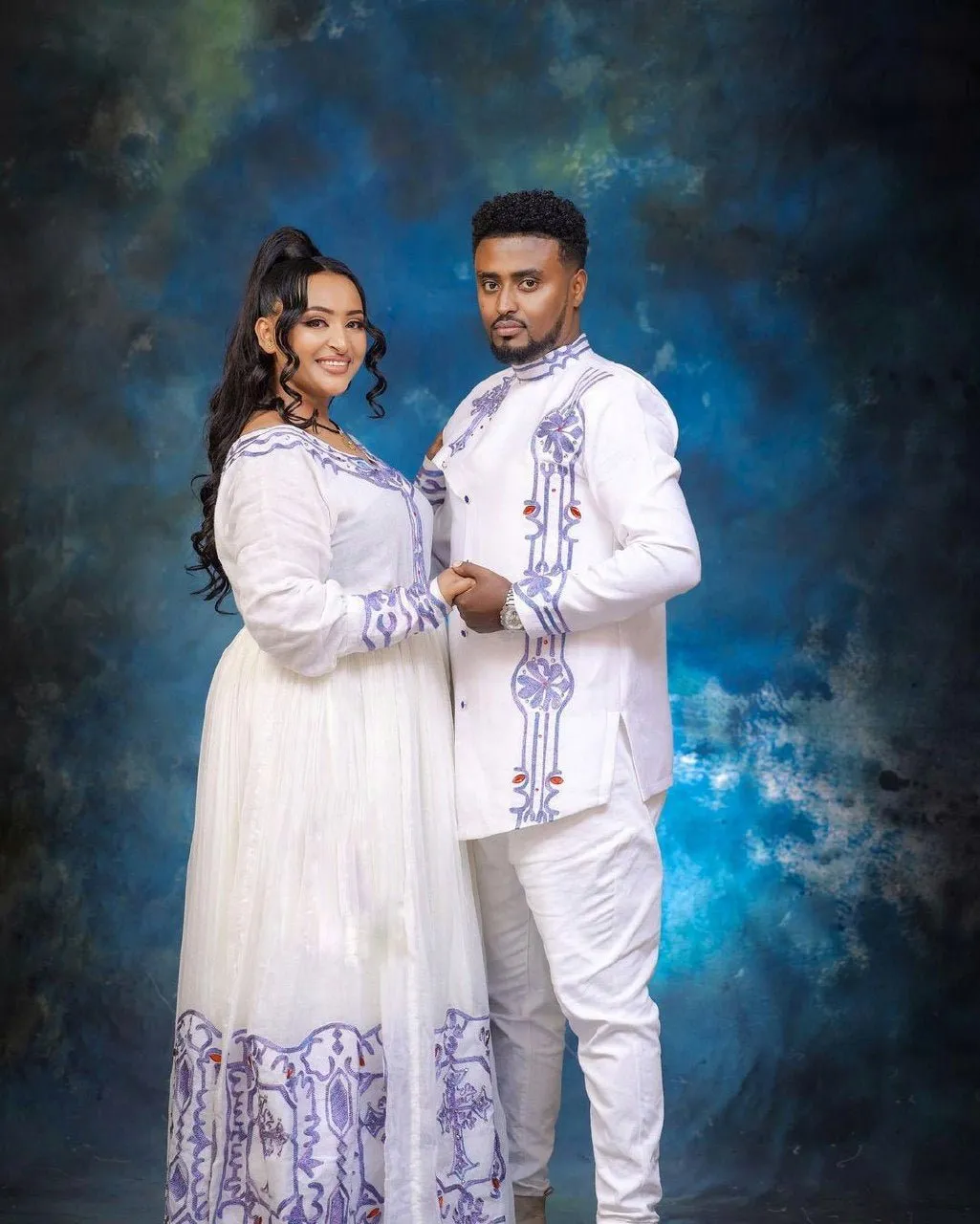 Blue Design Habesha Couples' Outfits in Ethereal Light Hues